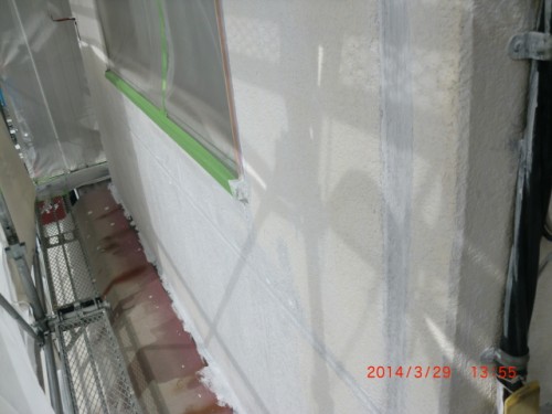 CIMG0404 | 外壁塗装は神奈川県横浜市の塗装職人 Exterior wall under construction with foam insulation panels, green-taped window opening, and metal scaffolding on the left.